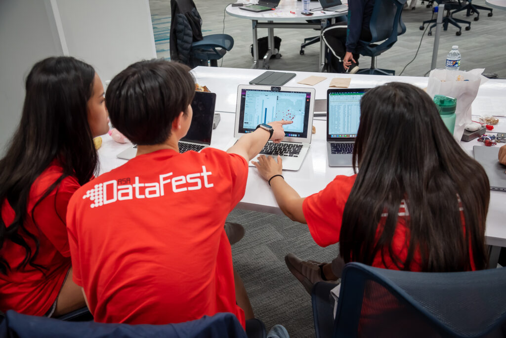 Three students working together on their DataFest at NC State data set. 