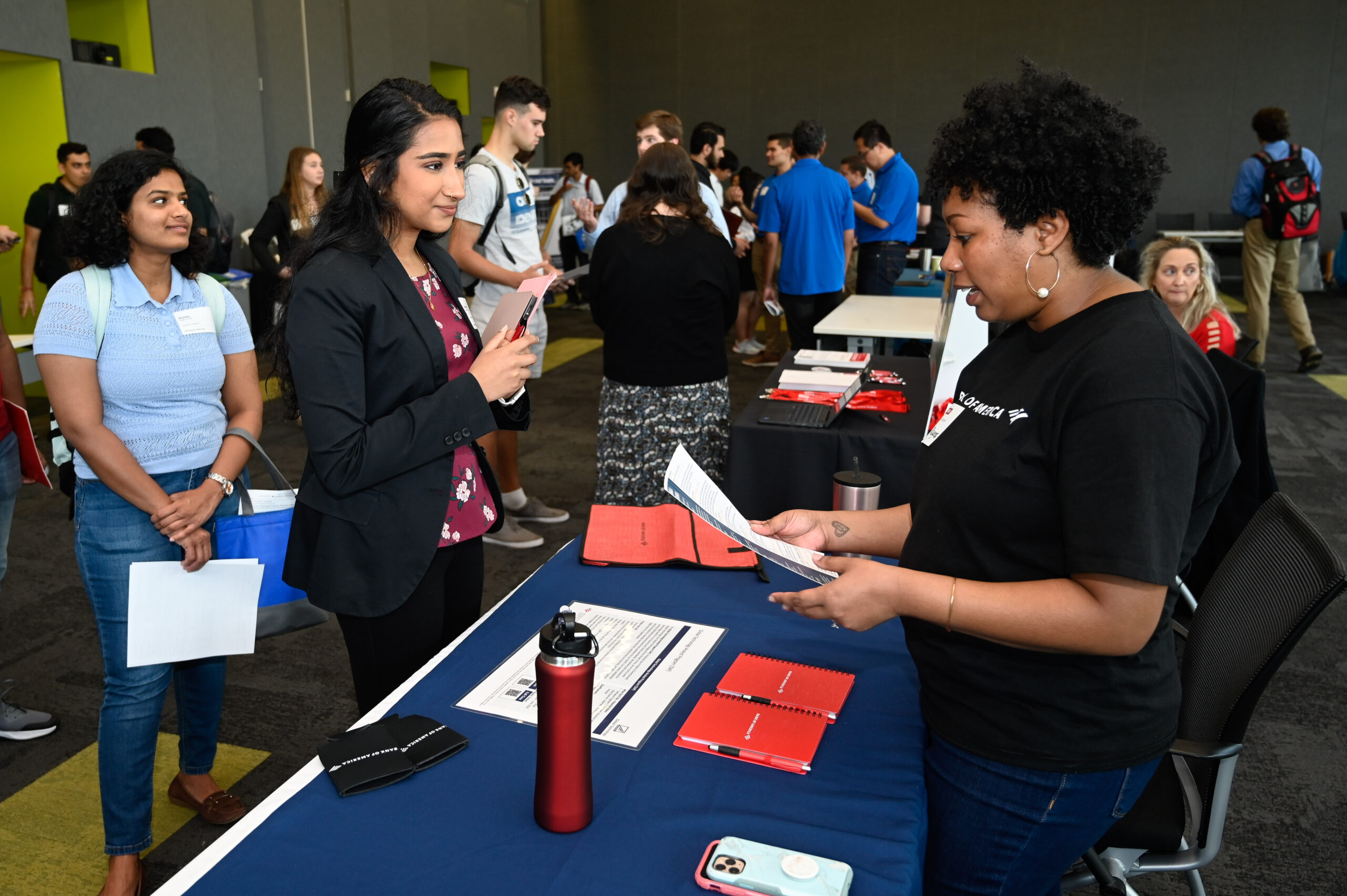 Student interacting wither employer at the Data Science Career Expo